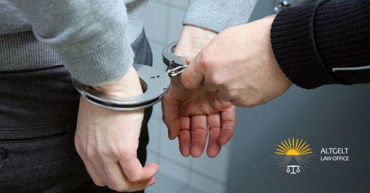 man in handcuffs being arrested